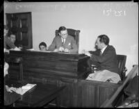 Coroner Frank Nance listens to testimony from Roland West at the grand jury hearings into death of actress Thelma Todd, December 18, 1935