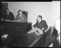 Coroner Frank Nance listens to testimony from Roland West at the grand jury hearings into death of actress Thelma Todd, December 18, 1935