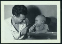 Aldous Huxley with unidentified infant [descriptive]