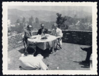 Aldous Huxley seated at a table with Gerald Heard and Abraham Kaplan [descriptive]