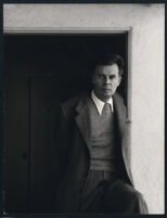 Aldous Huxley, standing in doorway [descriptive]