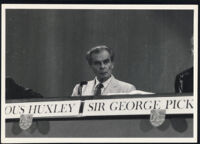 Aldous Huxley seated at panel, Dartmouth College, Hanover NH [descriptive]