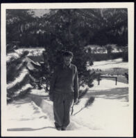 Aldous Huxley standing in snow [descriptive]