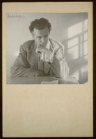 Aldous Huxley portrait, hand to chin, looking down wearing tweed blazer, in writing studio, Llano CA [descriptive]