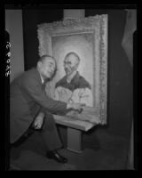 Dr. Jacob de la Faille points to an inscription on a self-portrait by Vincent van Gogh, Los Angeles, 1949