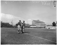 USC football coaches Sam Barry and Hobbs Adams before the opening game of the season, Los Angeles, September 1937