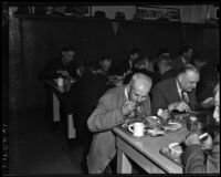 Men enjoy Thanksgiving dinner at the Midnight Mission, Los Angeles, November 25, 1937