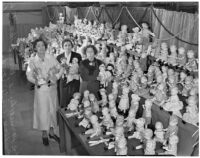 Harriet Lund, Bernice Haverty, and Prudence Winterrowd at the Los Angeles County Jail with dolls donated at Christmastime, 1930s