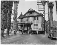 House on wheels being moved to a new location, currently pictured at the intersection of 10th and Parkview, Los Angeles, circa 1938