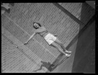 Janice Lipking, a Zeta Tau Alpha sorority sister at UCLA, playing badminton at a summer rush party, Los Angeles, July 29, 1937