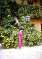 Alicia standing by the hotel garden