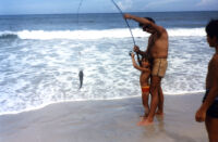 Eduardo and his children fishing