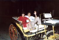 Alicia and Eduardo riding a carriage