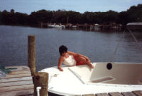 Alicia posing on a boat