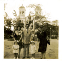 The Guardia Family posing in front of church