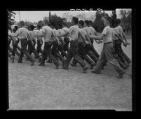 Residents of Fred C. Nelles School for Boys march to work, 1955.