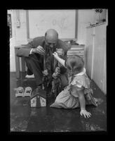 Child psychiatrist Dr. M. B. Durfee and a girl during play therapy, Pasadena, 1955