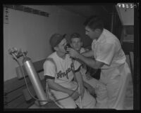 Angels baseball team member receives oxygen as therapy, Los Angeles, 1956