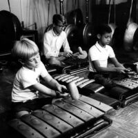 Marlowe Hood and Robbie Robinson (children) playing on the UCLA Javanese gamelan instruments