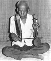 Blind man bowing a two-stringed lute