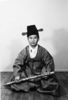 Dong Youp Lee holding a woodwind instrument
