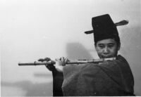 Dong Youp Lee playing a woodwind instrument