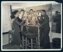 Informal gathering at the bar in Walter Gordon's office, Los Angeles, 1940s