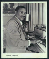 Signed publicity photo of Charlie Lampkin at a piano, 1950s