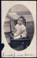 Postcard of baby seated in chair, New Orleans, 1888(?)