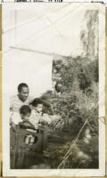 Unidentified African American man with two children