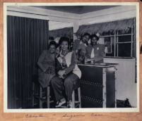 Gathering at the bar in Walter L. Gordon, Jr.'s office, Los Angeles, 1940s