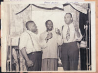 Louis (Louie) Jordan and Herman Hill making a toast, Los Angeles, 1940s