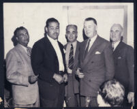 Boxer Joe Louis at a reception with Los Angeles officials, Los Angeles, 1940s
