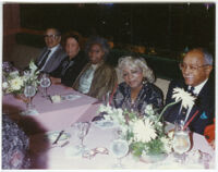 Walter Gordon, Jr., seated at a restaurant table wit h others, Los Angeles, 1980s