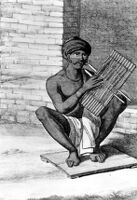 Photo of an engraving of an Indian playing sitar
