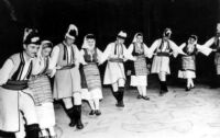 Shrove Tuesday figures in costume with accompanying musicians