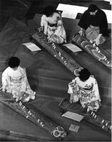 Overhead shot of UCLA's koto ensemble. Three Women and one man playing kotos