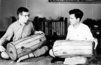 Two men playing kendangs