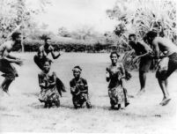Ghana dance ensemble with female and male dancers