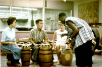 Robert Ayitee instructing students on drums