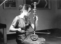 Woman playing a bowed fiddle