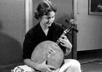 Woman playing a short necked lute
