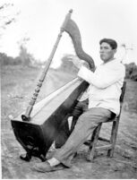 Photo of man playing harp