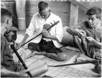 Two men playing stick zither