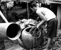 Removing the hide-rope from the pottery-vessel where it has been soaking