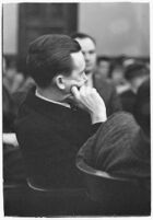 Widower Robert S. James sitting in a courtroom during an inquest involving his wife's death, Los Angeles, 1935