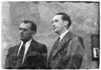 Murder suspect Robert S. James standing between two unidentified men in court, Los Angeles, 1936