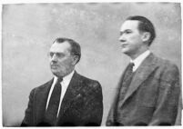 Murder suspect Robert S. James standing between two unidentified men in court, Los Angeles, 1936