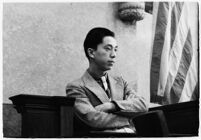 Hal Takaoka, brother of a slain dancer, testifying on the witness stand, Los Angeles, 1936