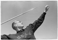 UCLA track athlete preparing to throw a javelin, Los Angeles, 1937